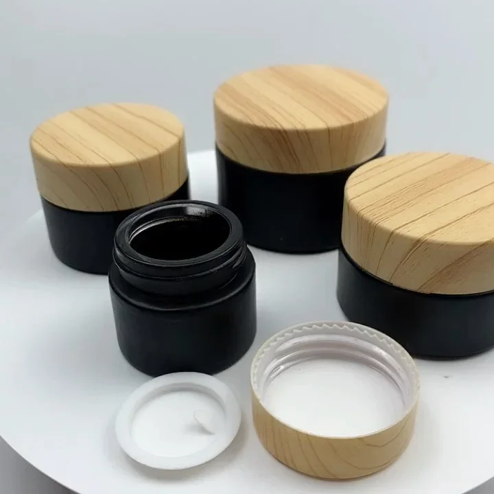 غطاء قطارة من الخيزران، زجاجة مصل زجاجية سوداء غير لامعة، زجاجة زجاجية غير لامعة، برطمان كريم زجاجي بلوري أسود مع غطاء حبوب خشبية بلاستيكية