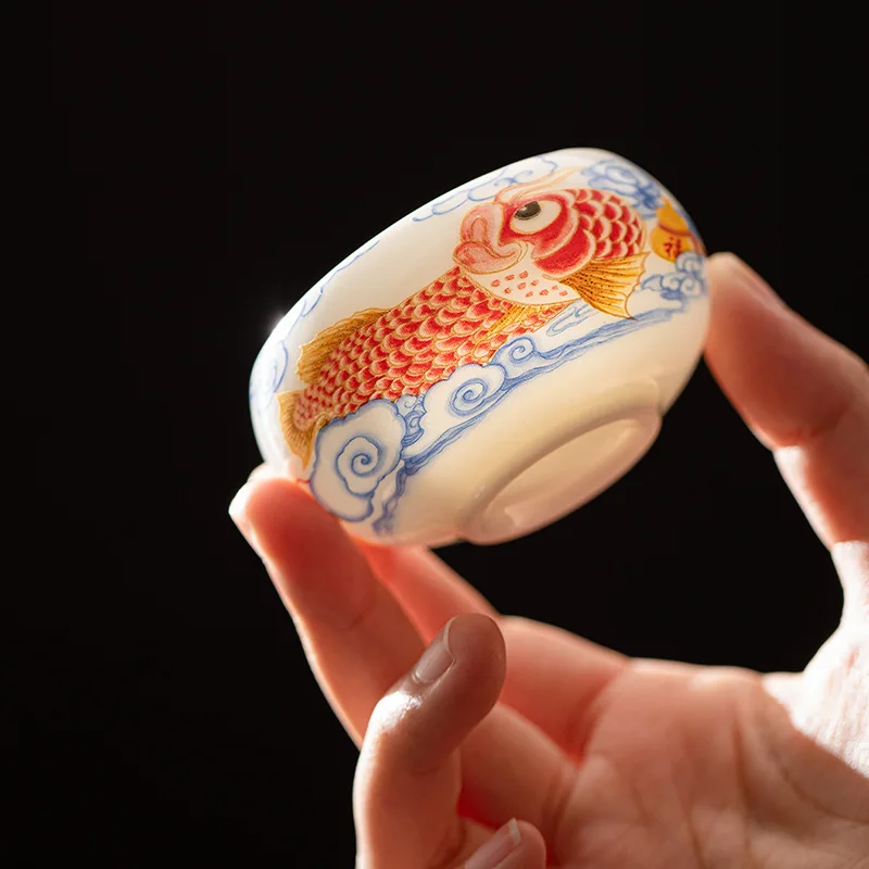 Taza de té de pez dragón de porcelana de Jade blanco, juego de té de Kung Fu, taza pequeña para beber en el hogar, taza de agua de cerámica, taza de degustación