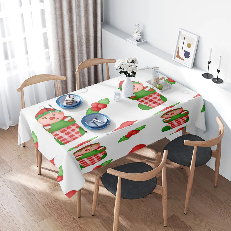 Christmas-themed tablecloth featuring adorable elves and festive food designs for holiday dining decor.
