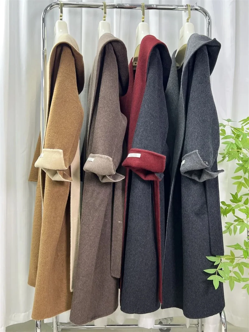 เสื้อโค้ทกันลมผ้าวูลลำลองสำหรับผู้หญิง รุ่นใหม่ ฤดูใบไม้ร่วง ฤดูหนาว ปี 2025 สไตล์เกาหลี ทรงหลวม ความยาวปานกลาง ผ้าวูลสองด้าน