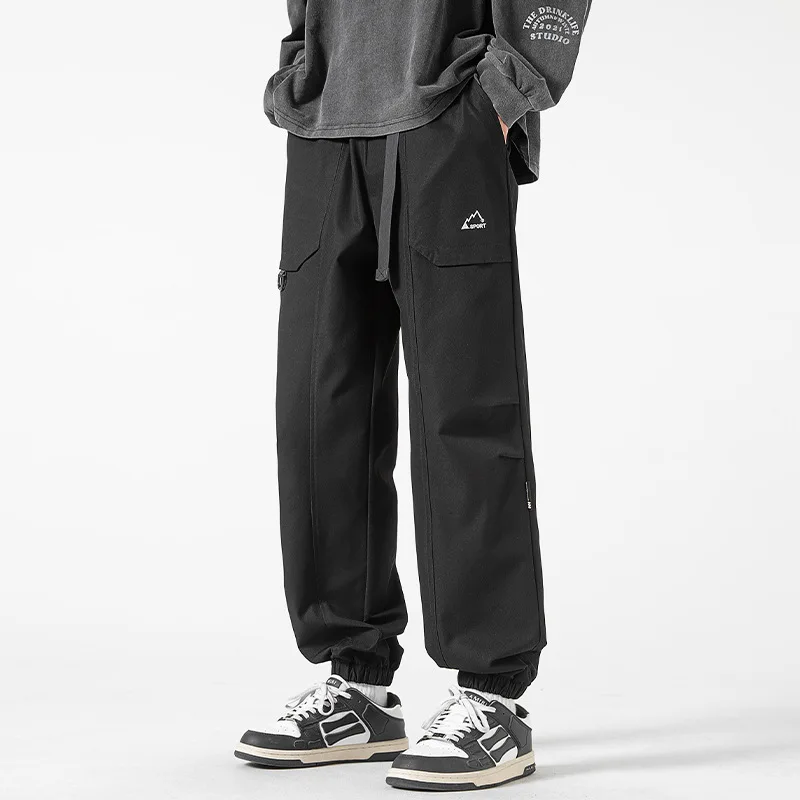 

Casual overalls in autumn are simple and versatile loose cropped trousers with tied feet joggers men