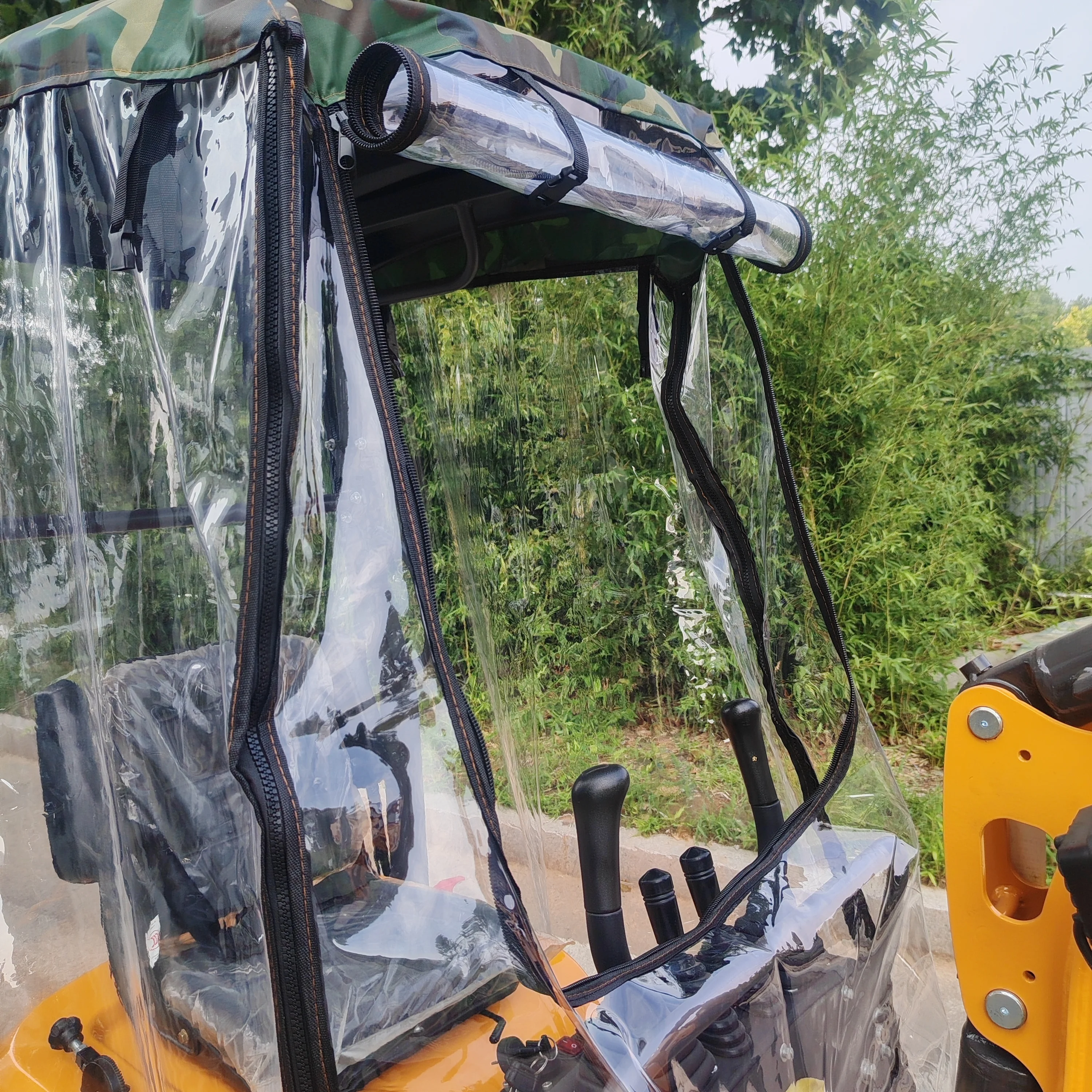 Multifunctional mini excavator, now equipped with a rain cover and an integrated counterweight—ideal for use in orchards