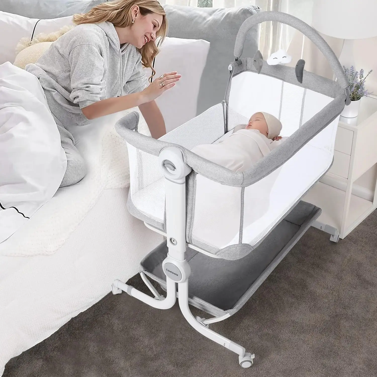 Baby Bassinet Bedside Sleeper with Storage Basket, Wheels and Toys, Easy Folding Portable Bassinet for Newborn