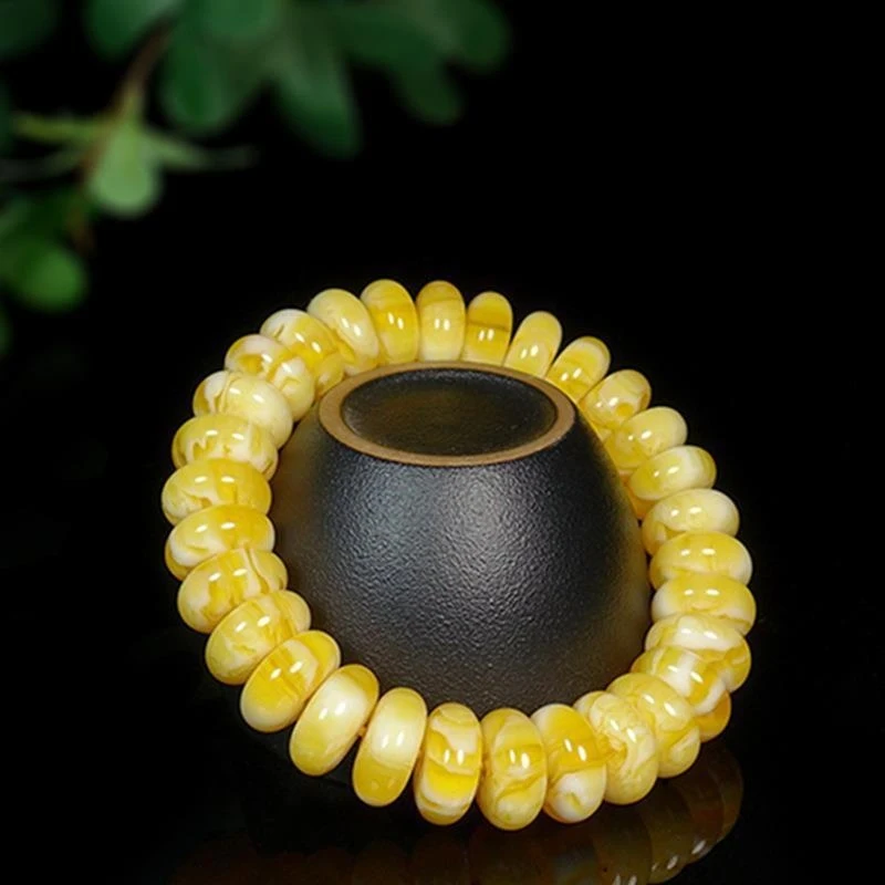 New Baltic Sea bracelet with amber , gold, star moon designs, wheel and abacus-shaped separator beads