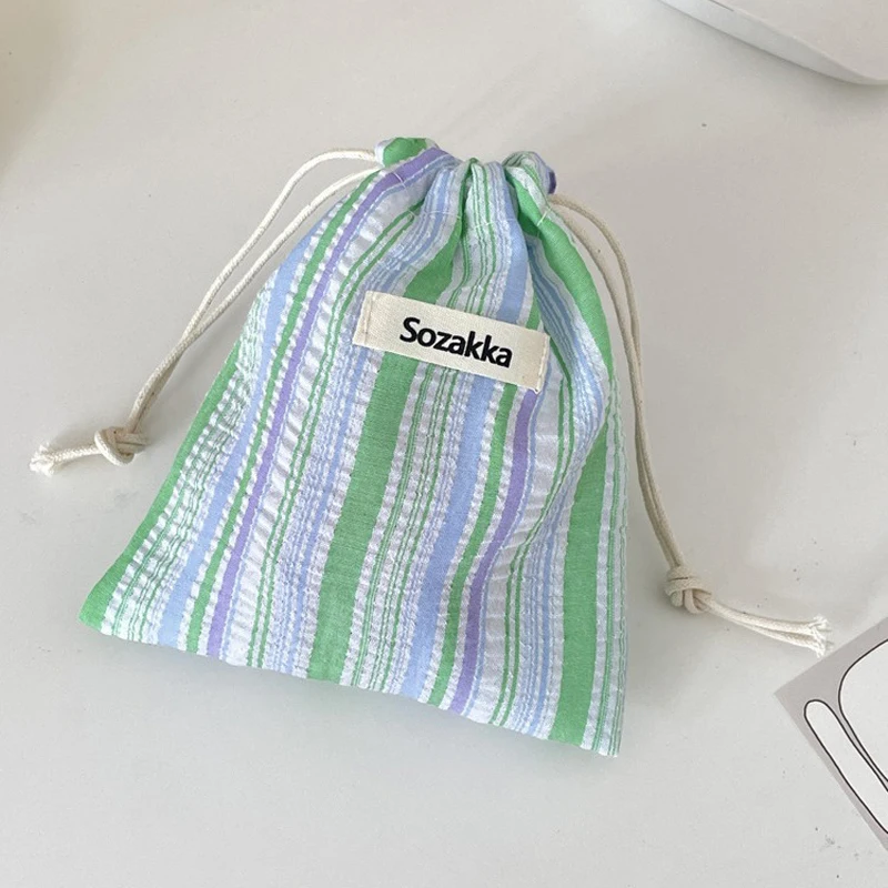 กระเป๋าแต่งหน้าของผู้หญิงญี่ปุ่นจีบลายเชือกรูดกระเป๋าแบบพกพาขนาดกะทัดรัดกระเป๋าเดินทางธุรกิจกระเป๋าเครื่องสำอางสำหรับสาว