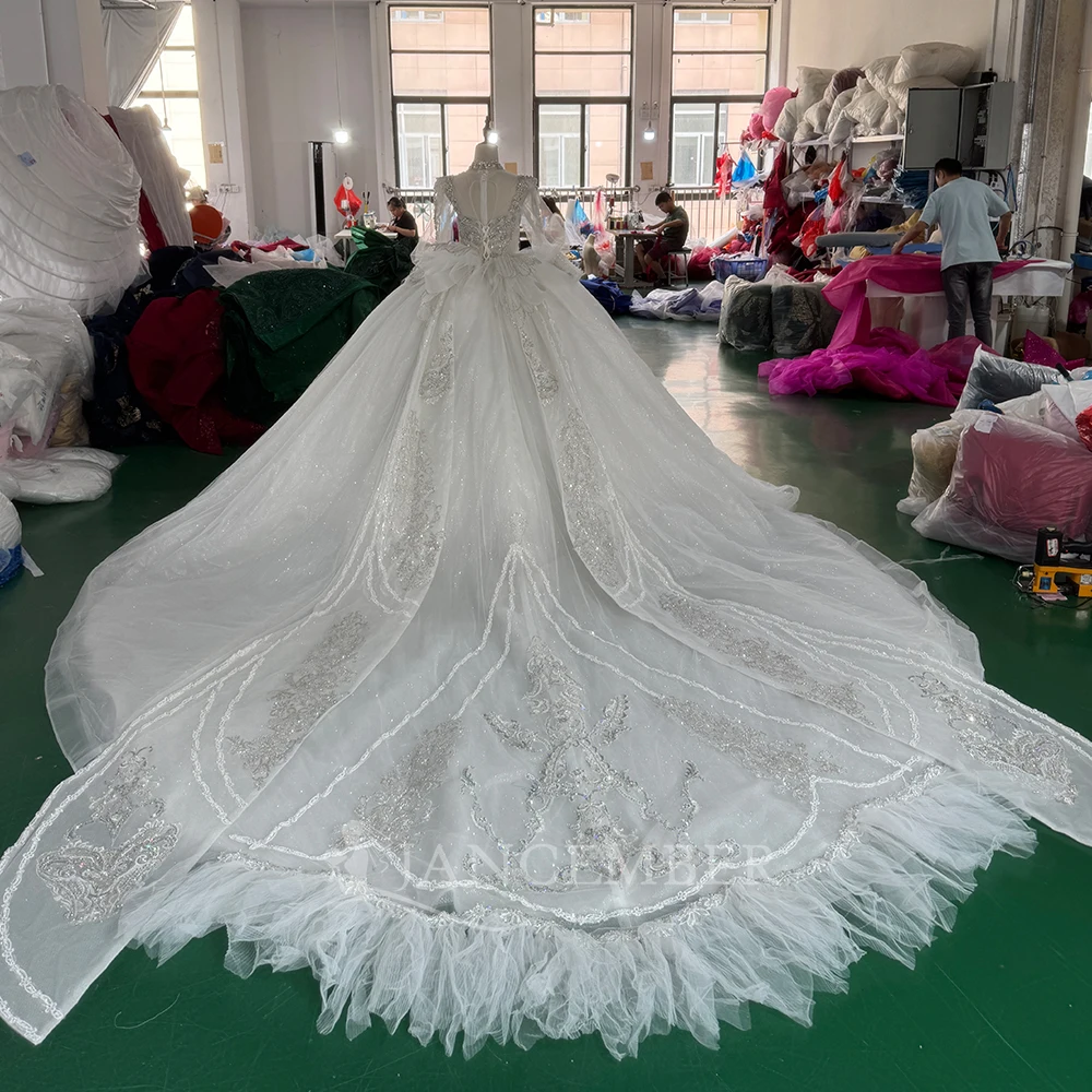 Gorgeous White Ball Gown Customized Wedding Dress High Neck Long Sheer Sleeves Crystal Beaded Chapel Train فساتين حفلات الزفاف