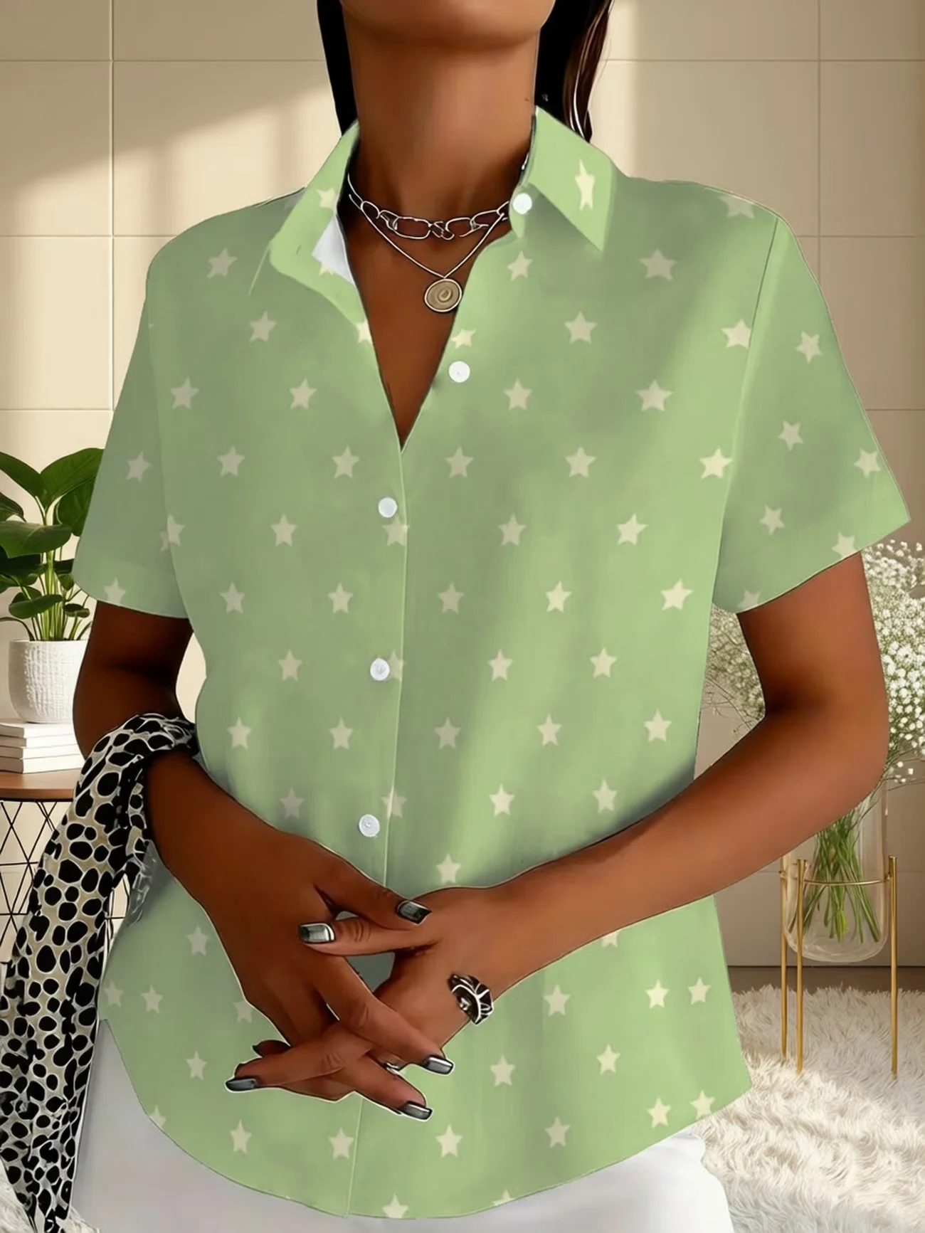 Women wearing short sleeve button up shirts with white black polka dot, cheetah leopard spot, and colorful floral abstract patterns with classic collar neckline