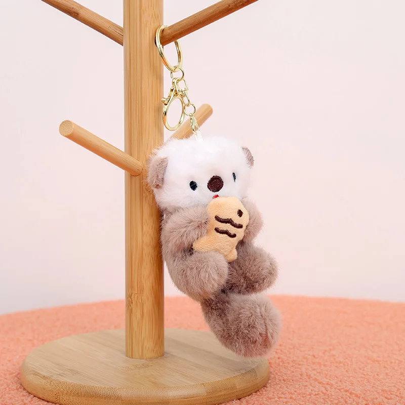 ZAKOL lindas lontras sosteniendo peces llavero colgante de felpa mochila llaveros colgante bolsa llave cartera colgante al por mayor