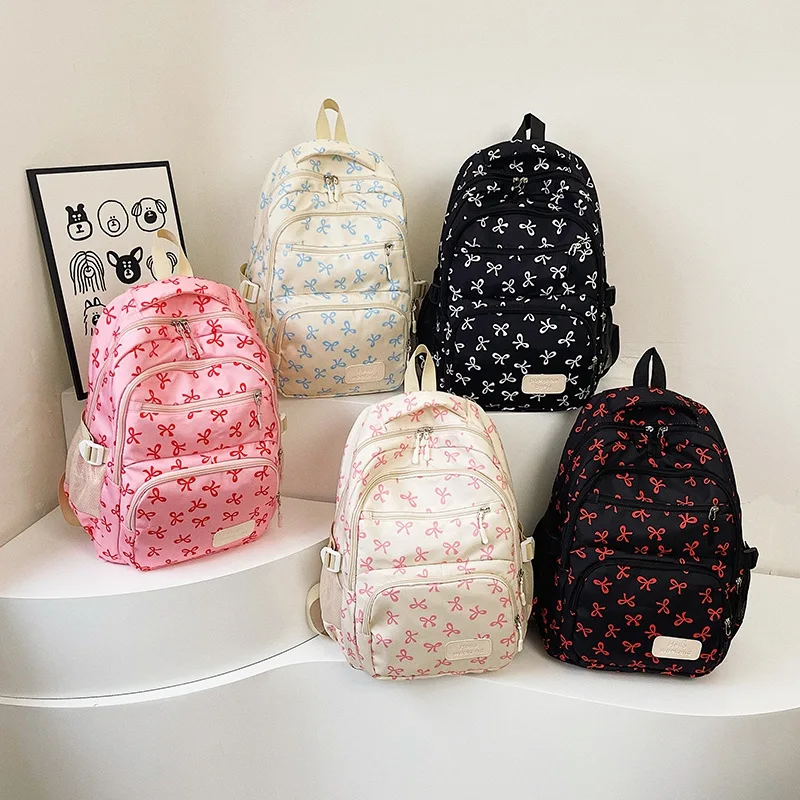 ชุดกระเป๋าเป้สะพายหลังลายโบว์น่ารักสำหรับเด็กผู้หญิง 3 ชิ้น น้ำหนักเบา เรียบง่าย เหมาะสำหรับนักเรียน  กระเป๋าเดินทางใส่โน้ตบุ๊คได้  จุของได้เยอะ