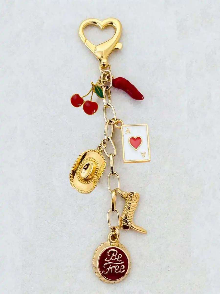 

Valentines Day Keychain Featuring Lucky Bottle Cap Design with Gold Boots Cowboy Hat Red Cherries Chili Pepper Heart Card and Sp