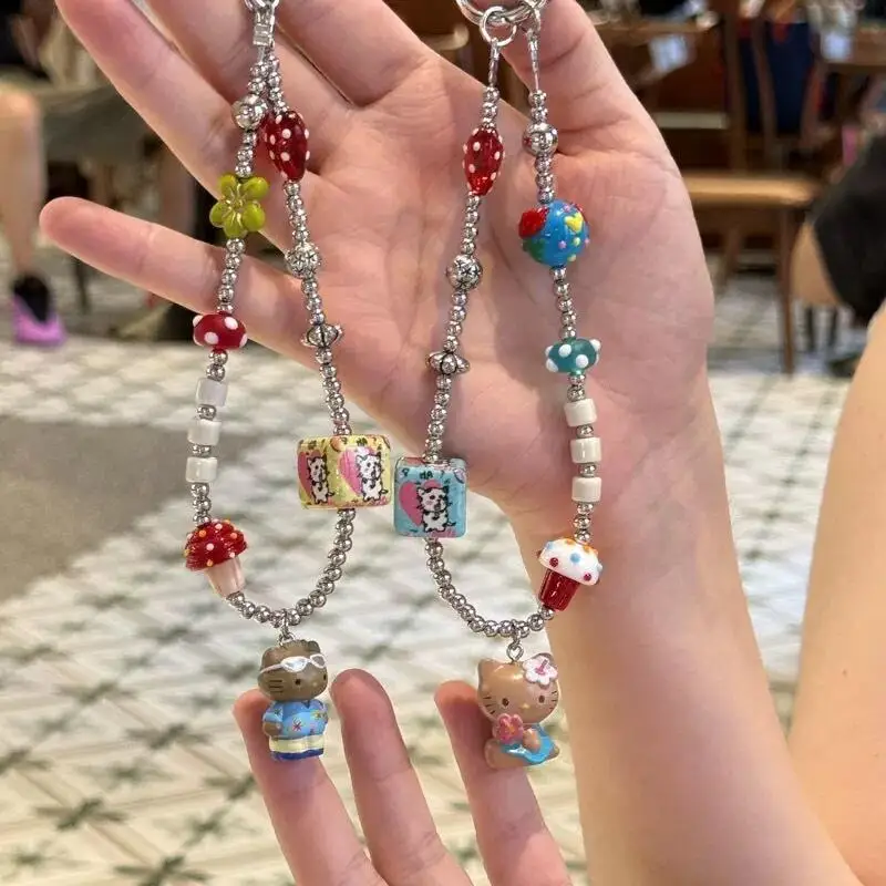 

Sanrio Summer Vacation Style Black Skin Hello Kitty Sweet Cool Beaded Phone Chain Cartoon Ccd Lanyard Bag Pendant Gifts