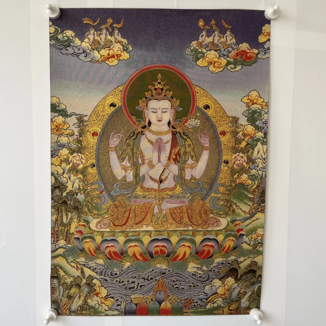 Precision embroidery of four-arm Guanyin thangka on Tibetan cloth in Tibet, China