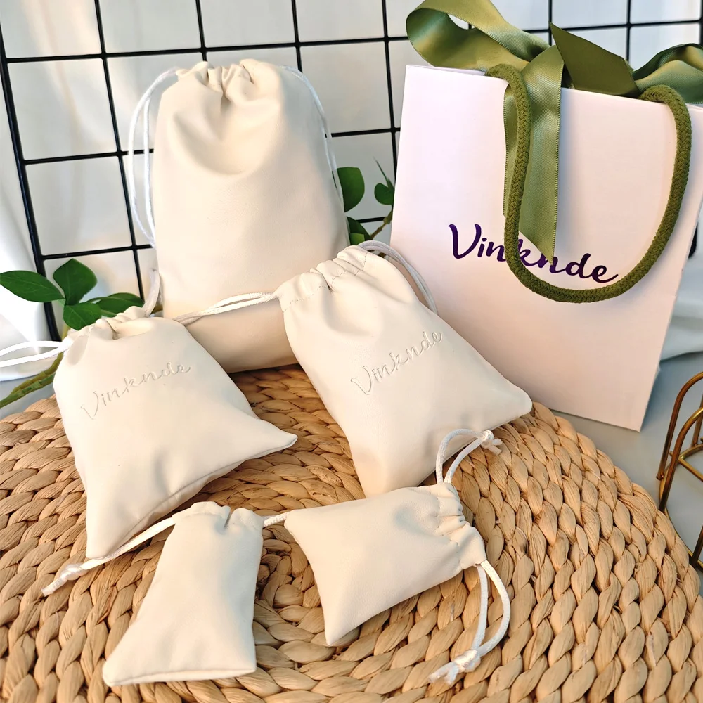 

Custom Logo White PU Leather Beauty Bag Luxury Makeup Jewelry Package Drawstring Pouch Wedding Travel Brush Toiletries Dust Sack