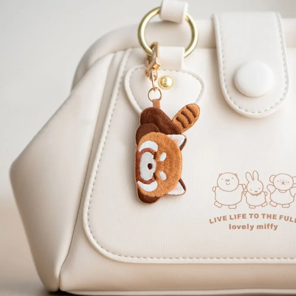 Divertente cartone animato panda rosso portachiavi moda creativa ciondolo animale kawaii lecca-lecca morbida panda rosso ricamo ciondolo regalo dello zoo