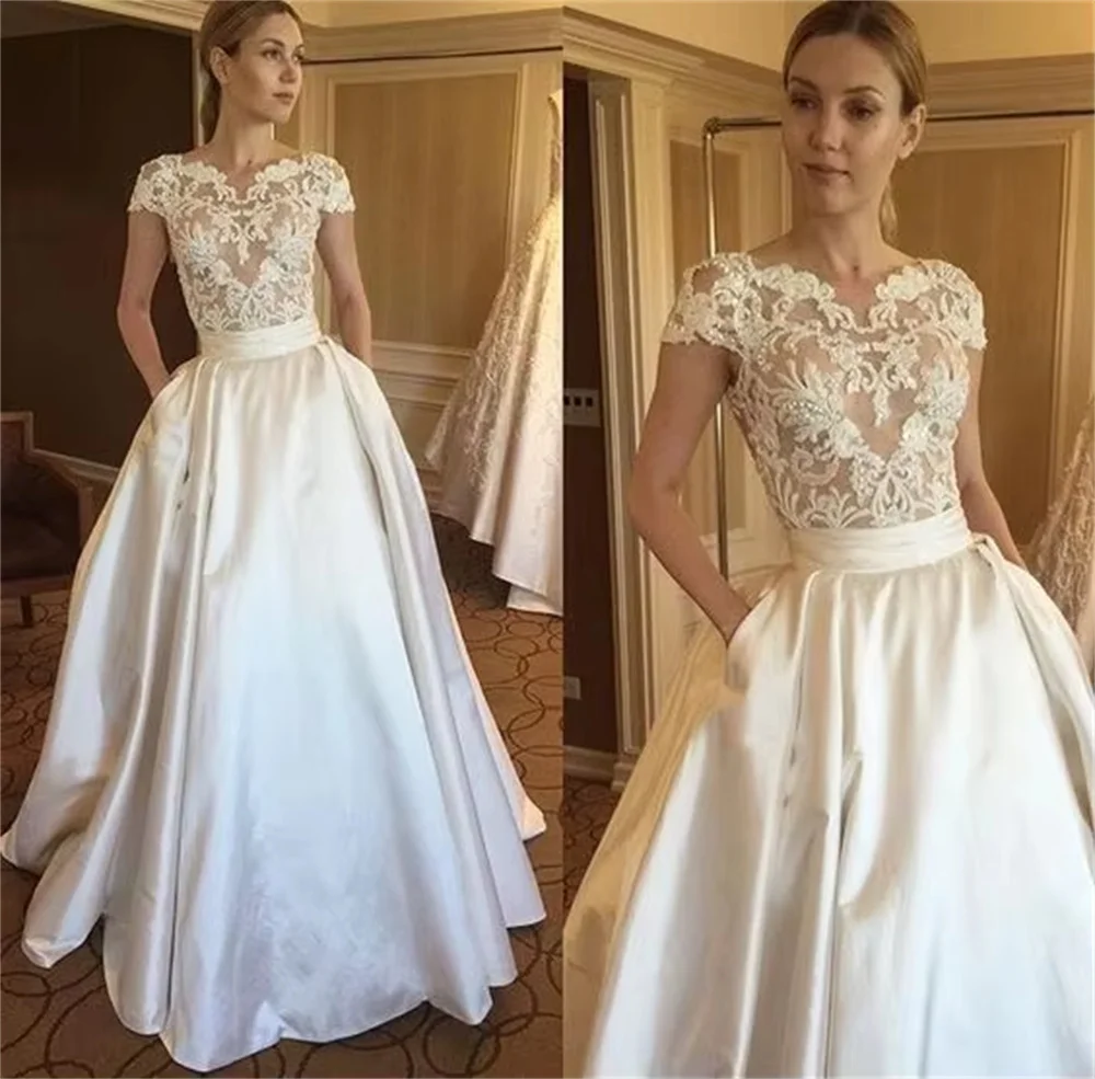 Suknie ślubne koronkowe zroszony 2020 vestido de novia czapka Vintage rękaw bez pleców panna młoda sukienka z kieszeniami elegancki biały kość słoniowa