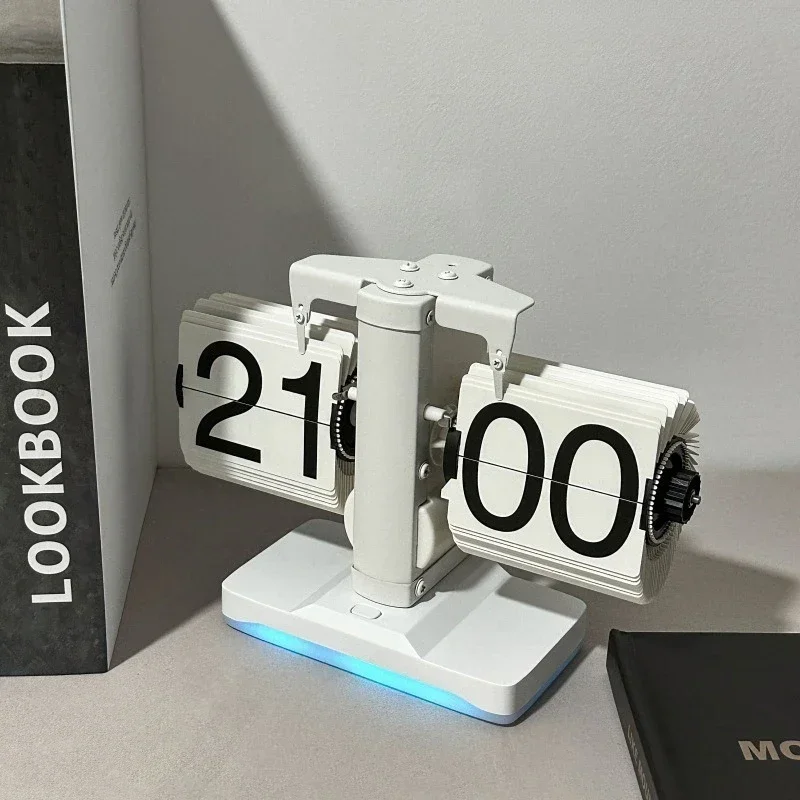 Creative automatic page turning clock with ambient light Living room ornament table clock Modern mechanical
