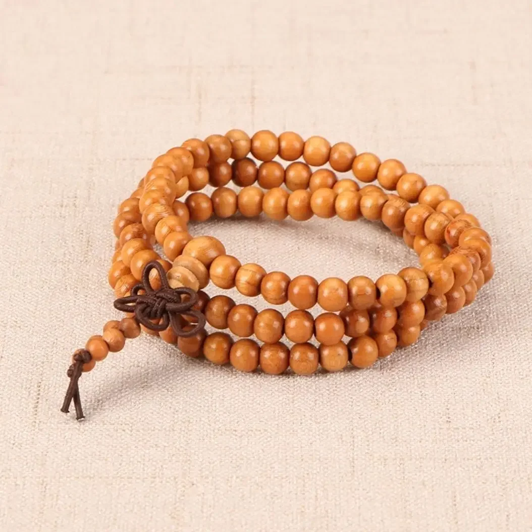 

Natural peach wood bracelet for men and women with 108 carved beads for the year of the zodiac. Wooden bracelet