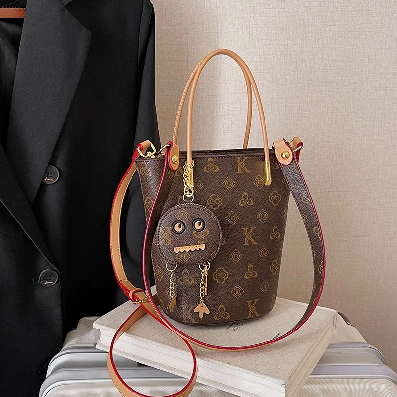 New High-end Printed Hand-held Bucket Bag with Pendant for Women Light Luxury Classic Single Shoulder Crossbody Bag Daily Use