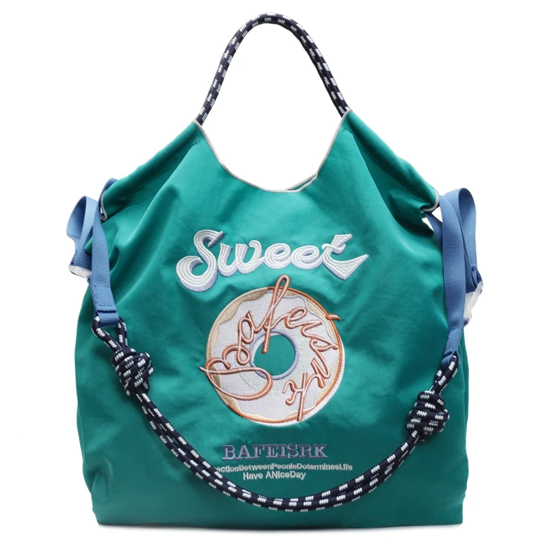 2025 Borse a tracolla e a tracolla con ciambella ricamate squisite di vendita calda primaverile Borse tote portatili solide di grande capacità per le donne