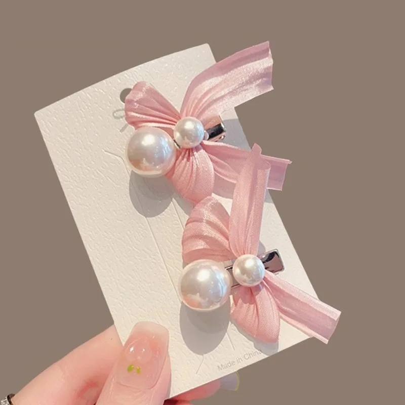 ใหม่หวานโบว์ไข่มุกผมคลิปสําหรับเด็กผู้หญิงสีชมพู Bowknot เจ้าหญิงด้านคลิป Bangs คลิปเด็ก Barrettes อุปกรณ์เสริมผม