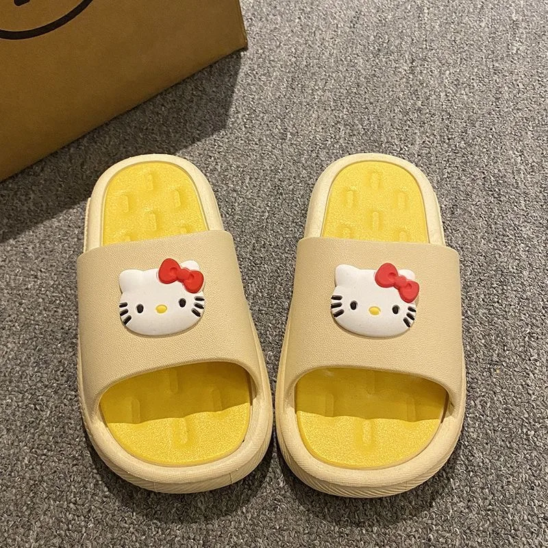 

Cute cartoon cat wearing Hello Kitty slippers for women with thick soles and a sense of stepping on poop Indoor non slip slipper