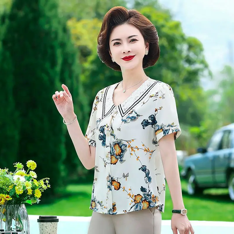 

Новые женские модные универсальные шифоновые рубашки с короткими рукавами и кукольным воротником с цветочным принтом