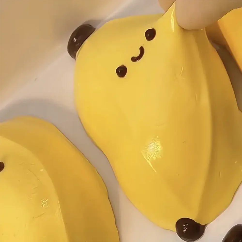 

Taba Squishy Banana Squeeze Toy - Cute Stress Relief Fidget Sensory Toys for Kids Adults Soft Fake Food Prank Gift for Birthday