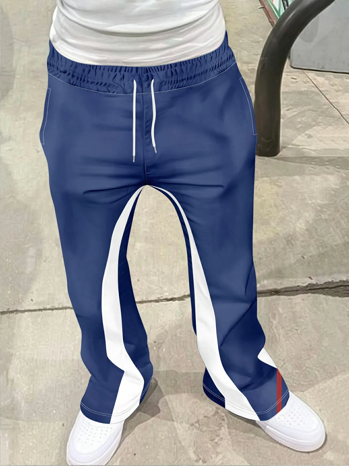 Pantalones de chándal informales para hombre, estilo callejero, con estampado cruzado, a la moda, ligeramente acampanados, diseño de bloques de Color en blanco y negro