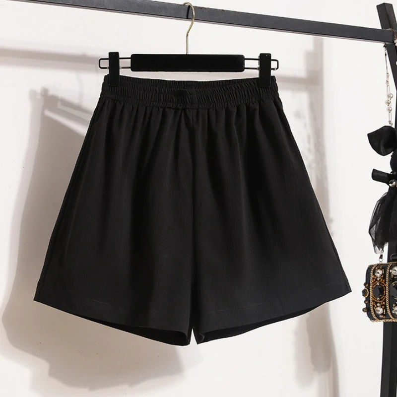 Damskie sportowe szorty z wysokim stanem, luźny krój, szerokie nogawki, jednolity kolor, kieszenie, elastyczna talia, krótkie spodnie, nowy styl 2025.
