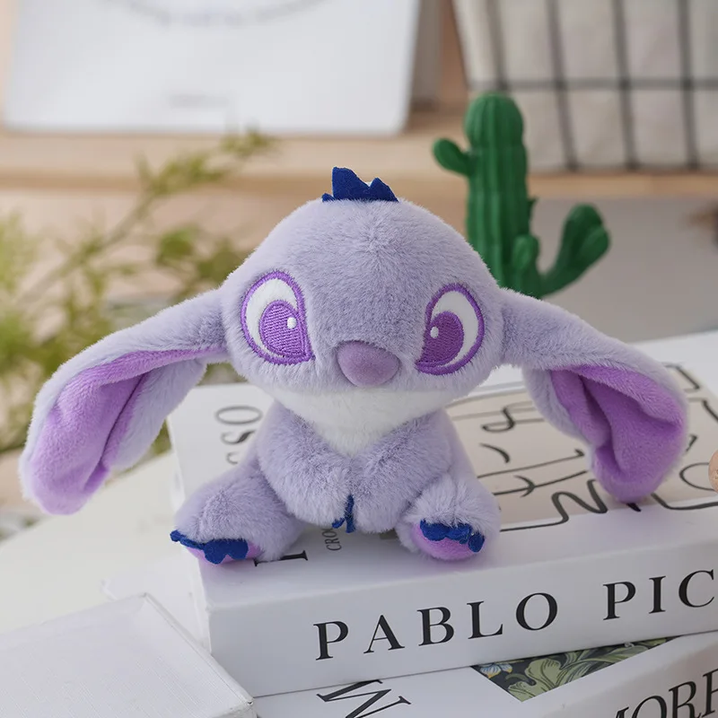 Lindo y encantador Stussy juguete de peluche llave llavero de peluche extraño juguete de peluche mochila colgante