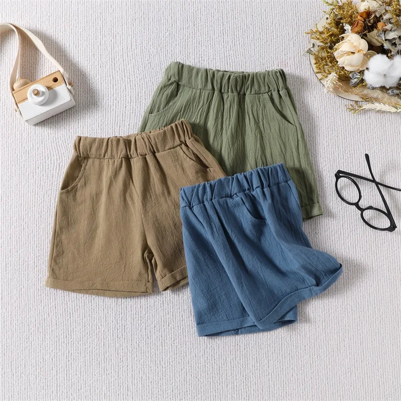 

2023-12-22 Lioraitiin Baby Girls Boys Shorts Casual Elastic Waistband Folded Hem Solid Color Summer Shorts with Pockets Clothes