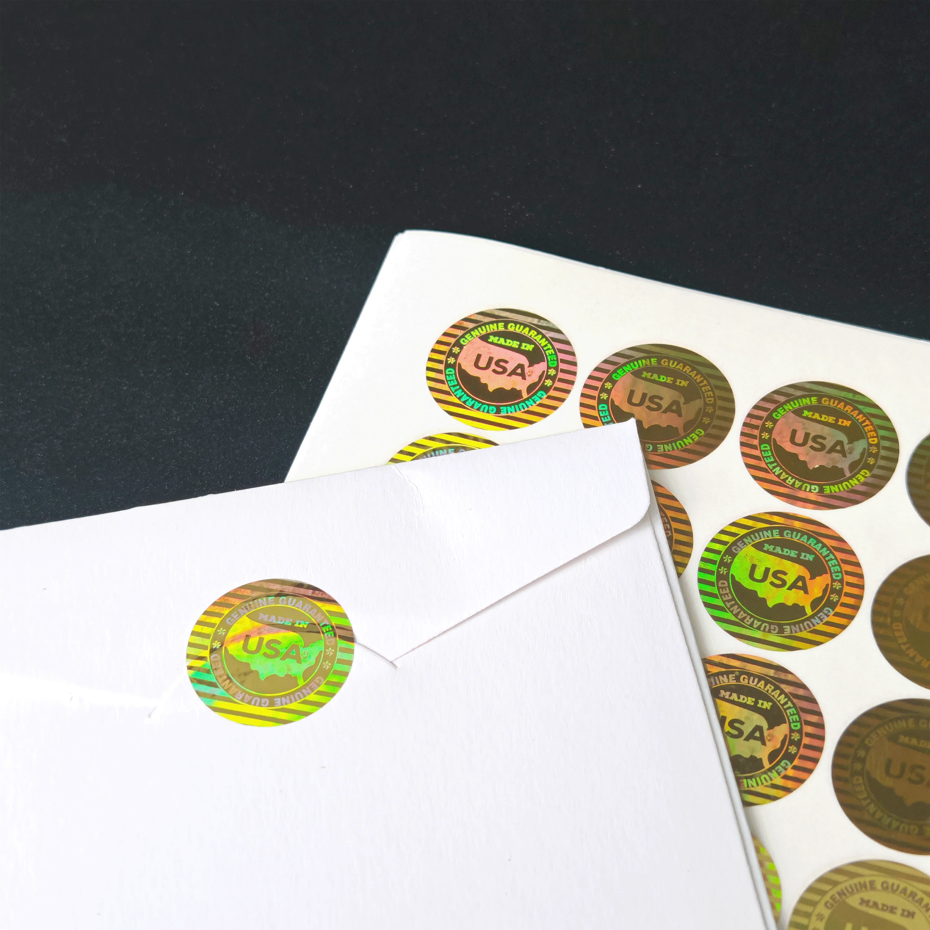 Naklejka hologramowa laserowa 20mm zabezpieczająca przed podrabianiem, etykieta gwarancyjna, plomba zabezpieczająca przed otwarciem, gwarancja, wyprodukowano w USA, naklejka do opakowań. — zdjęcie produktu 2