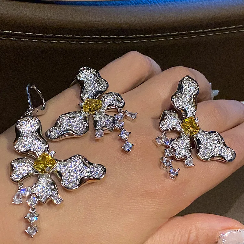 Butterfly Dangle Earrings Full Paved Clear Cubic Zirconia With Yellow Center Stone Tassel Drop Design Silver Tone