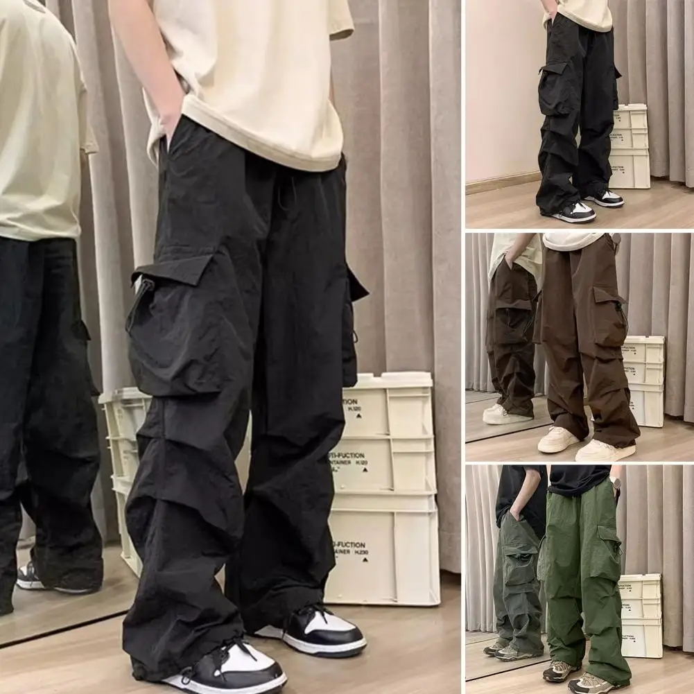 

Fashion Men Cargo Pants Multi Pockets Solid Color Loose Deep Crotch High Street Hip Hop Elasic Waist Full Length Long Trousers