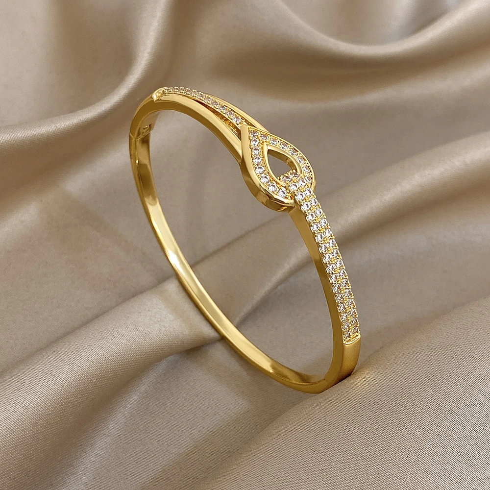 

DODOHAO Vintage Rhinestone Hollow Water Drop Cuff Bracelet Women Elegant Geometric Gold Color Spring Buckle Bangle Jewelry Gift