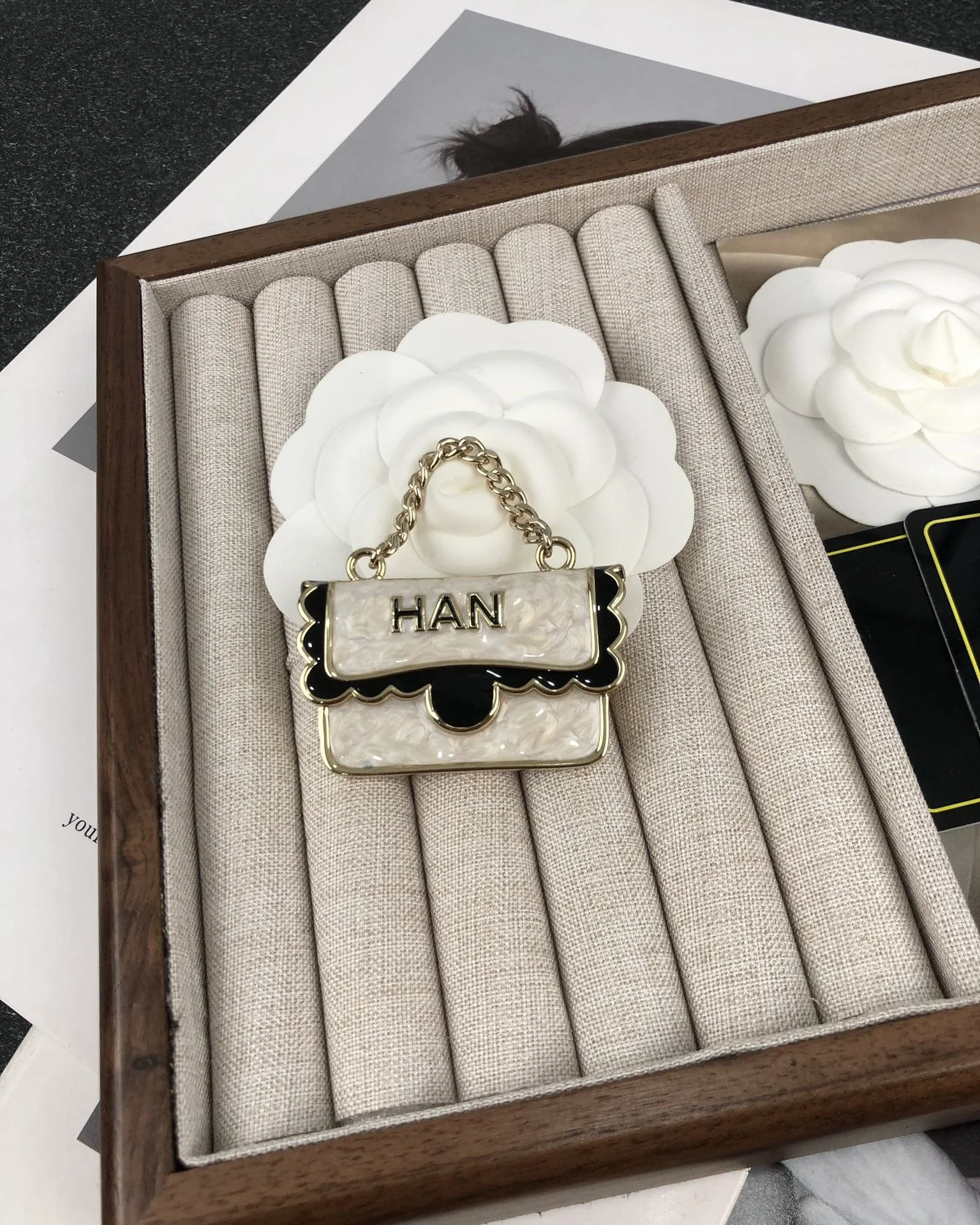 New black and white enamel French bag brooch