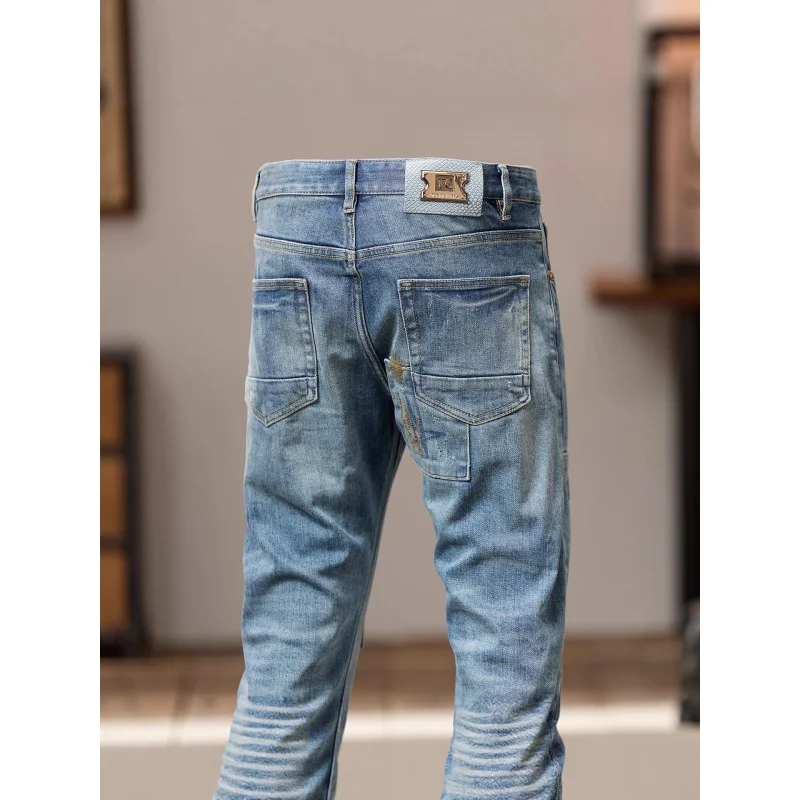 กางเกงยีนส์สีน้ำเงินวินเทจปี 2025 สำหรับผู้ชาย แบรนด์ทันสมัย ปักลาย แต่งขาด ดีไซน์แบบปะติด สไตล์เรโทร ทรงเข้ารูป ทรงสกินนี่