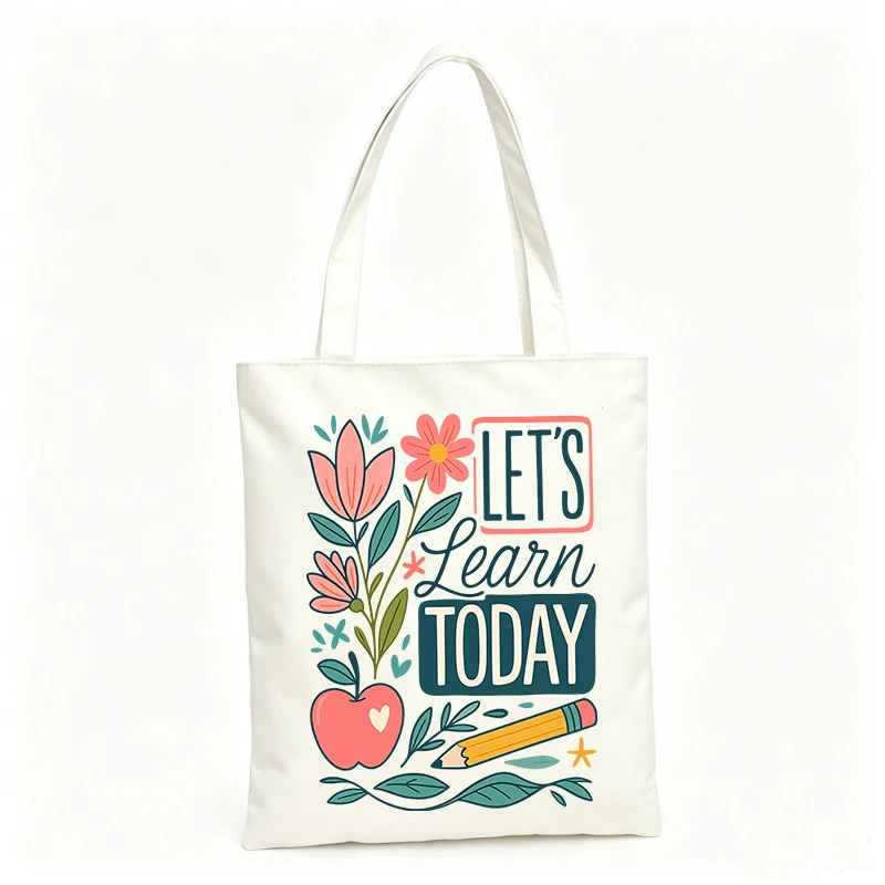 Women's floral and apple graphic canvas tote bag with typography print, ideal for daily use and casual outings
