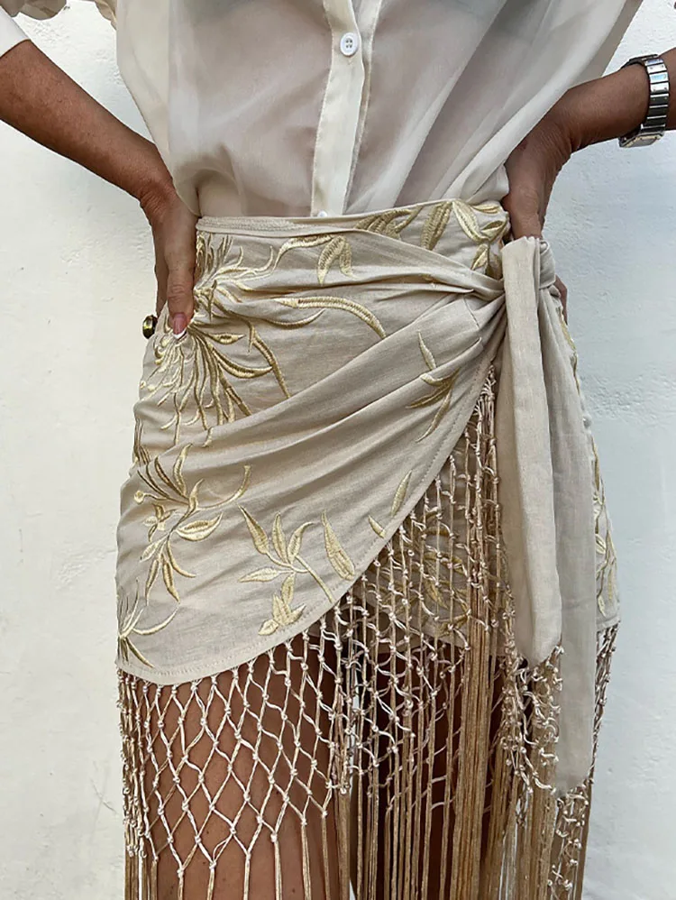 

2025 летняя новая шикарная женская пляжная праздничная одежда, длинная юбка с вышивкой и кисточками по подолу, женская элегантная сетчатая короткая юбка с вырезами