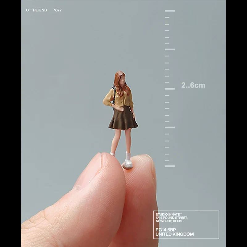 Long-haired, short-skirted backpack-carrying girl miniature doll realistic figure model color 3D small scene matching decoration