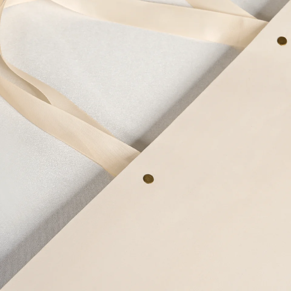 Custom Recycled  Luxury Cream Beige Shopping Paper Bags With Your Own Logo Ivory Clothes Packaging Gift Bag With Ribbon Handle