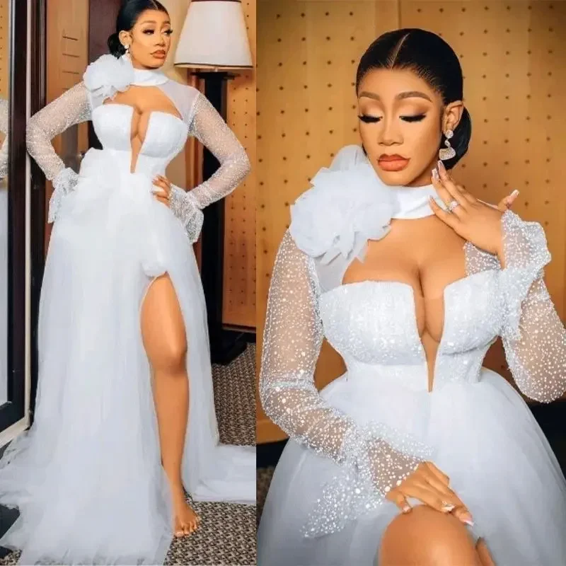 ชุดเจ้าสาวแบบสั่งตัด คอสูง แขนยาว ผ่าข้าง ชายกระโปรงยาวแบบลากพื้น ผ้าทูลล์เว้าข้าง ชุดแต่งงานสไตล์แอฟริกัน ชุดเจ้าสาวสำหรับงานเลี้ยงฉลองก่อนแต่งงาน