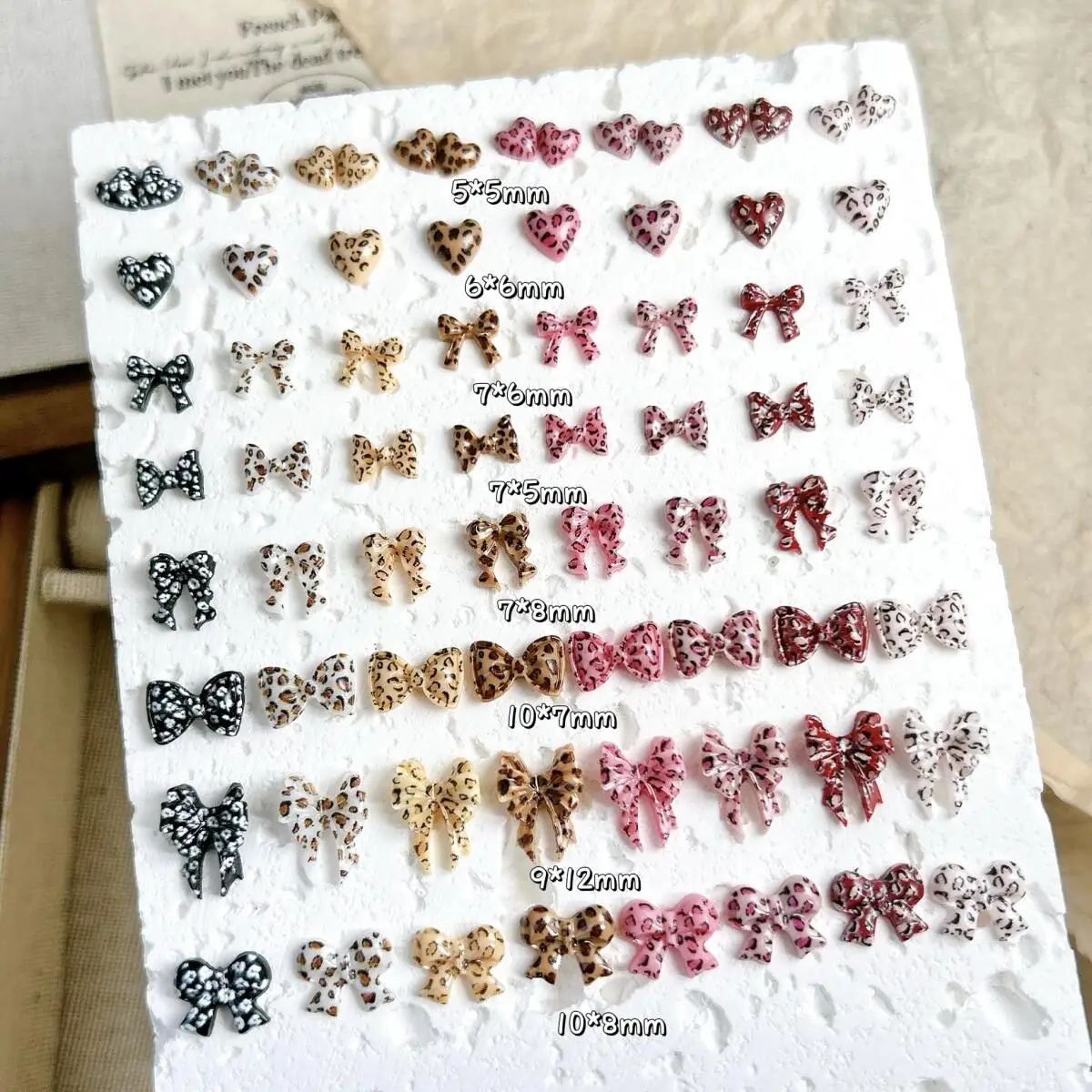 

50PCS New Creative Leopard Print Bow Heart Nail Art Charms Hot-selling Spotted Peach Heart Tie Nail Decorations DIY Nail Parts