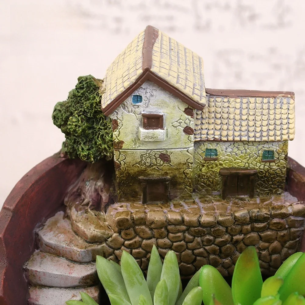 Artistic Hanging Garden Pot in Brown Resin Featuring Fantasy City Carving Dual Planting Space and Drainage Holes