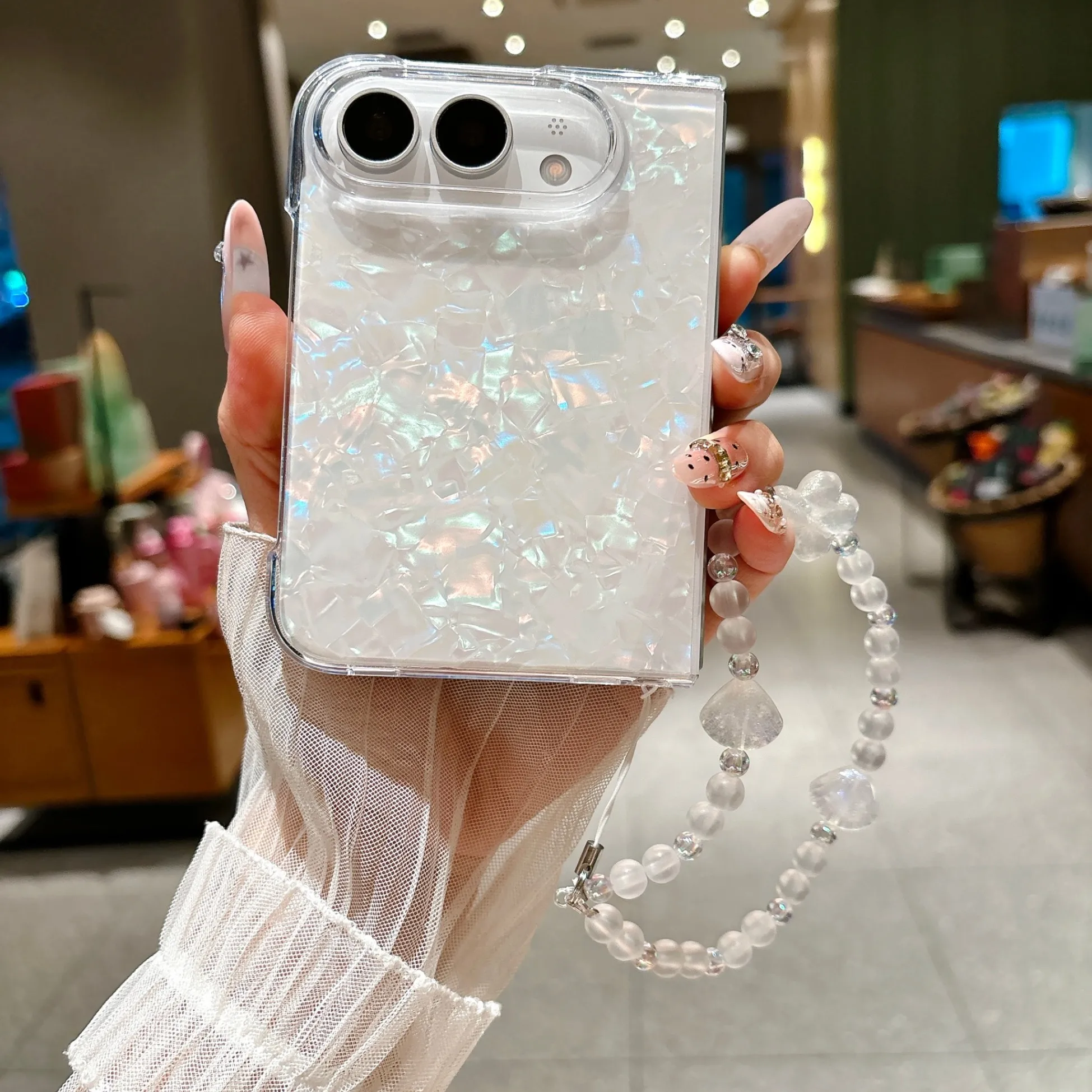 Iridescent Shell‑Pattern Hard  - огляд і ціна Camera Wrist Strap
