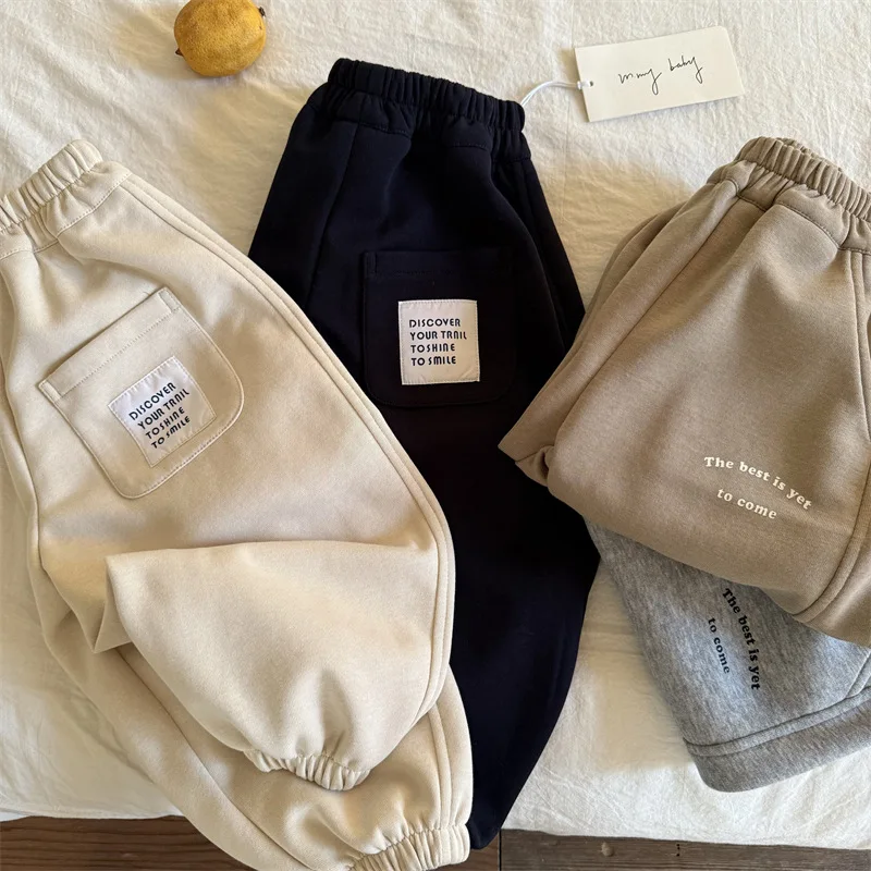 Children's trousers 2025 spring new boys and girls casual letter sweatpants baby simple leggings tide