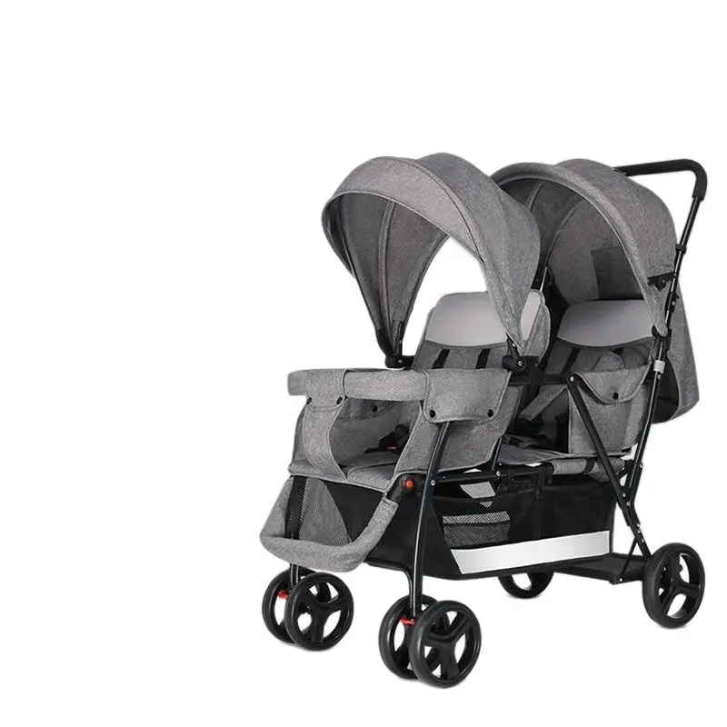 The twin strollers sit back and forth in the wheelbarrow, the size of the trolley, the twin trolley can sit and lie down.