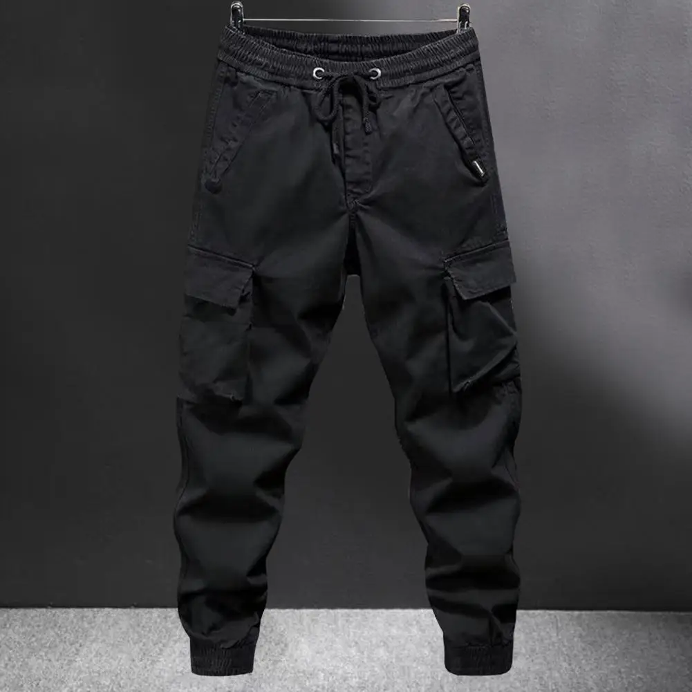 Celana Kargo Wanita dengan Banyak Saku Pinggang Elastis Tali Pergelangan Kaki Celana Panjang Luar Ruangan Pria Longgar Ukuran Besar untuk Perjalanan Berkemah dan Mendaki