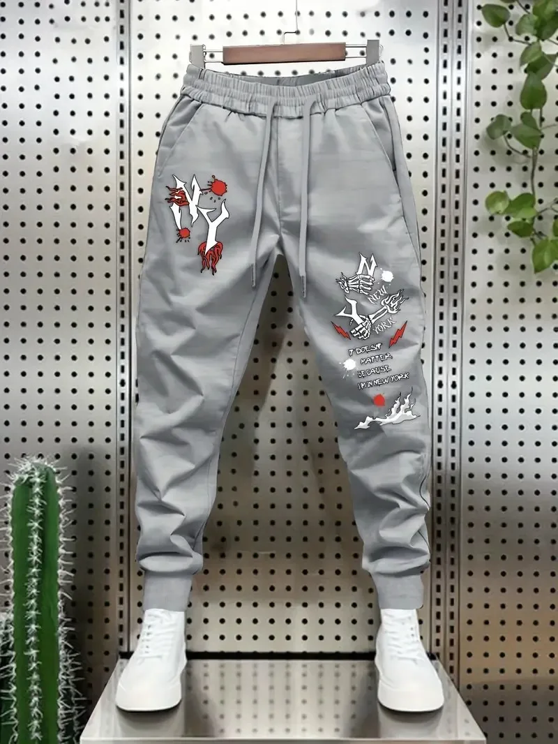 The new men's trousers for Spring and Autumn 2025 are casual fashionable soft comfortable and simple with 3D letter prints