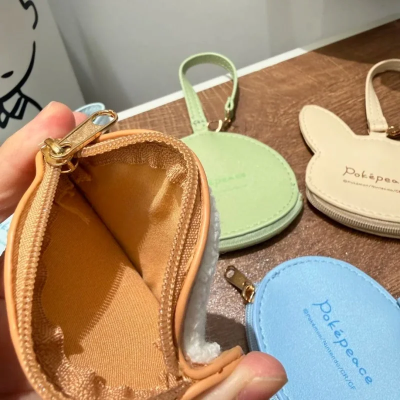Täglicher tragbarer Aufbewahrungsbeutel Pokepeace Münzbörse Pikachu Piplup Rowlet Scorbunny Tandemaus Chenille PU-Leder Handgelenktasche für Fans – Detail 3